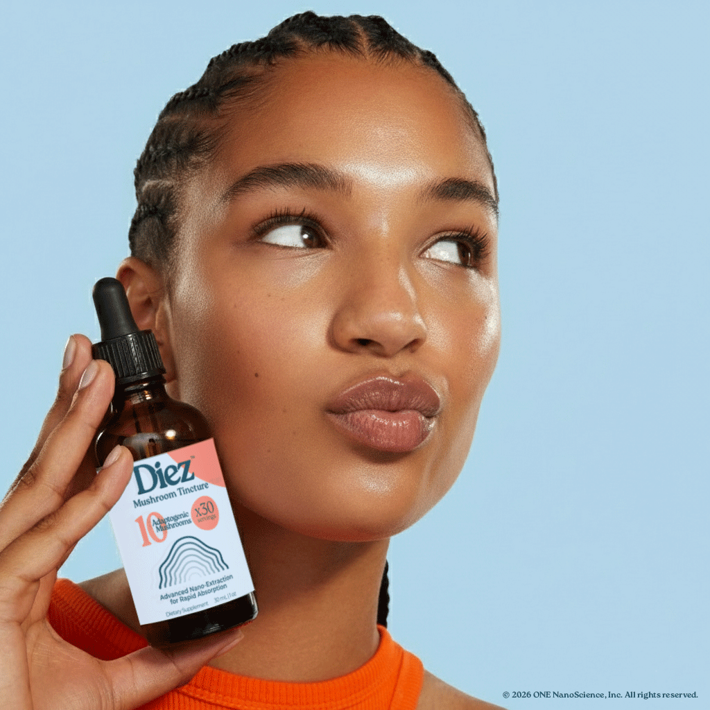 Alexa Holding a bottle of Diez Tincture